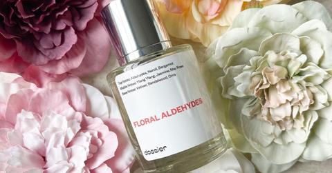 Photo of Dossier's Floral Aldehydes perfume in front of a textured floral background
