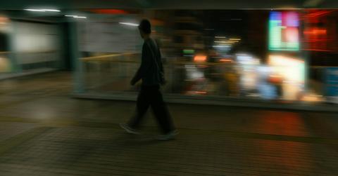blurred image of man walking