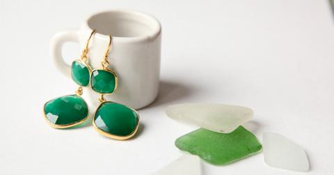 Green onyx earrings in a mug