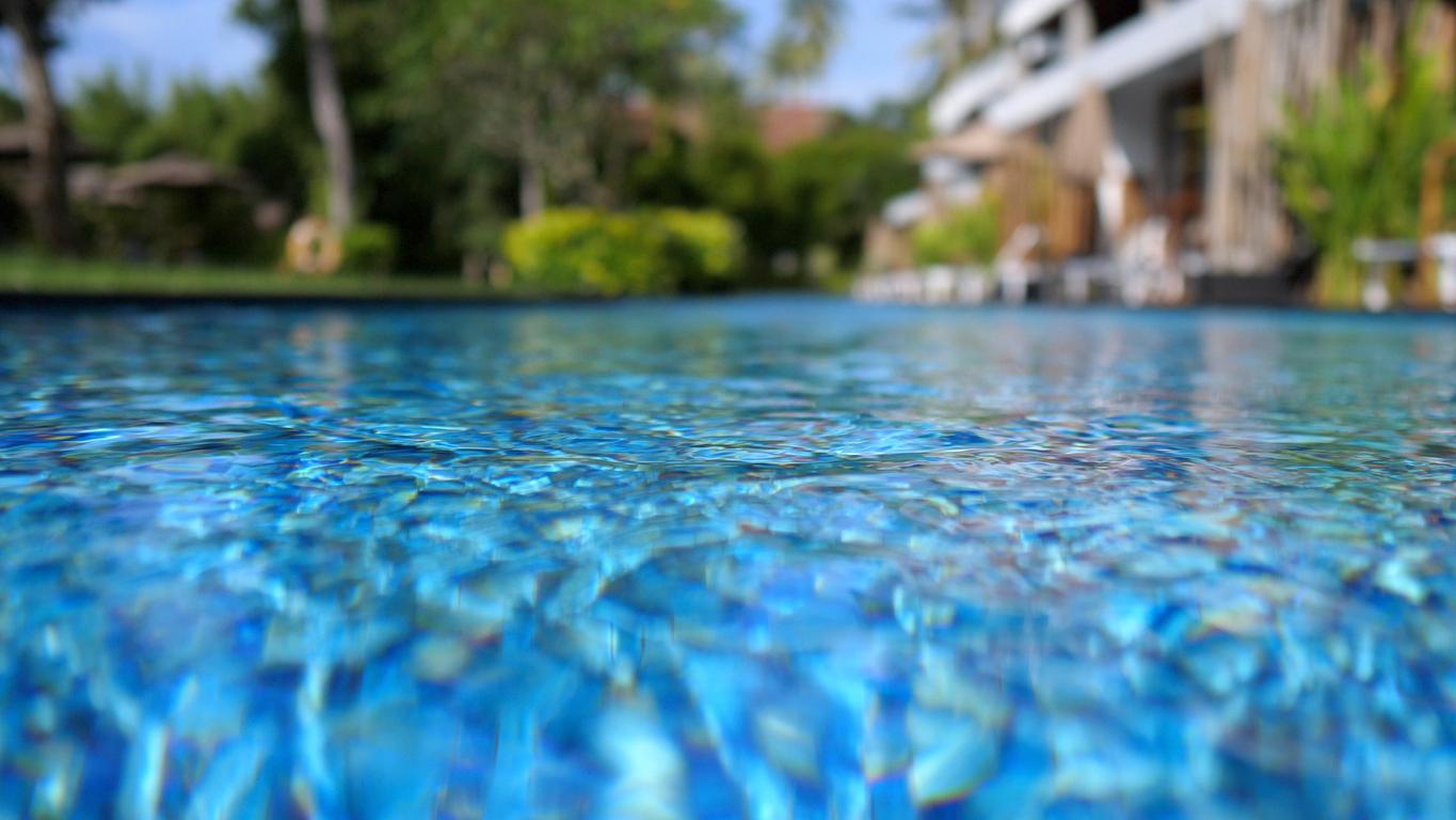 A close up of the surface of a pool. 