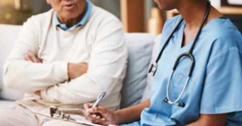 care worker talking to man