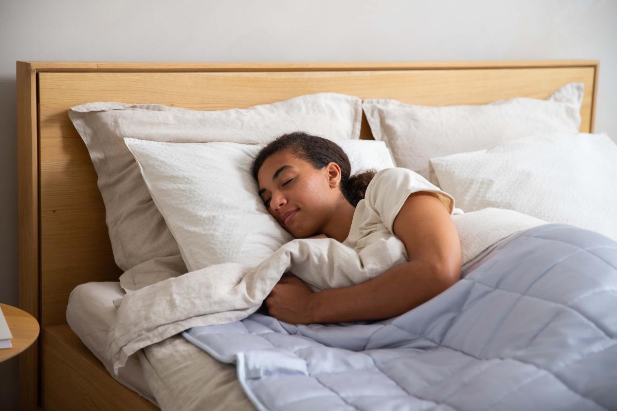 young woman sleeping peacefully in bed