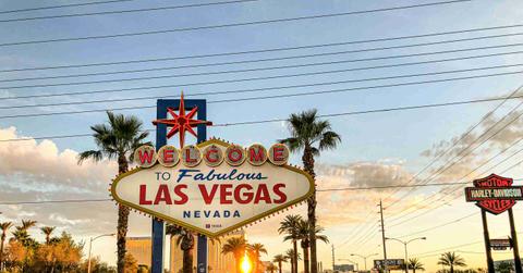 The "Welcome to Fabulous Las Vegas" sign is pictured at sunset.