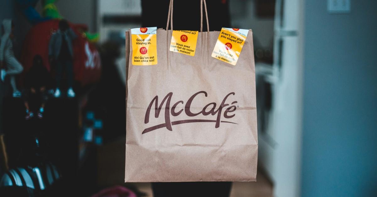 A McDonald's patron holds up a bag from the fast food chain