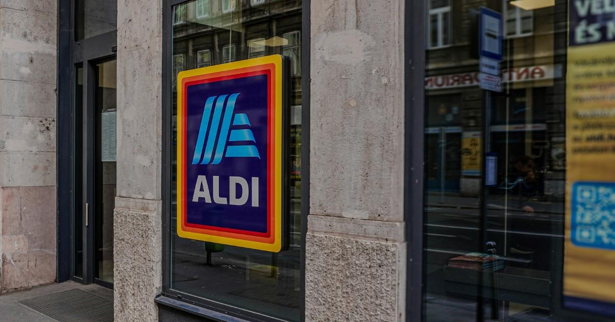 An Aldi sign hangs on a storefront 