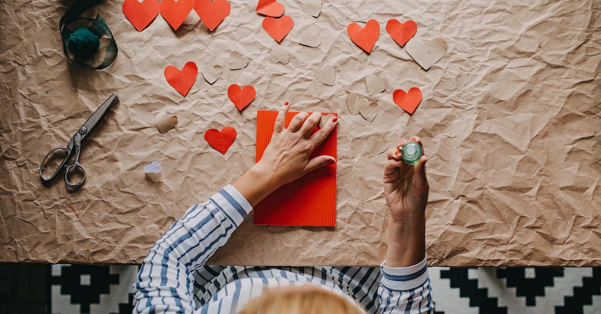 Person making Valentine's Day cards