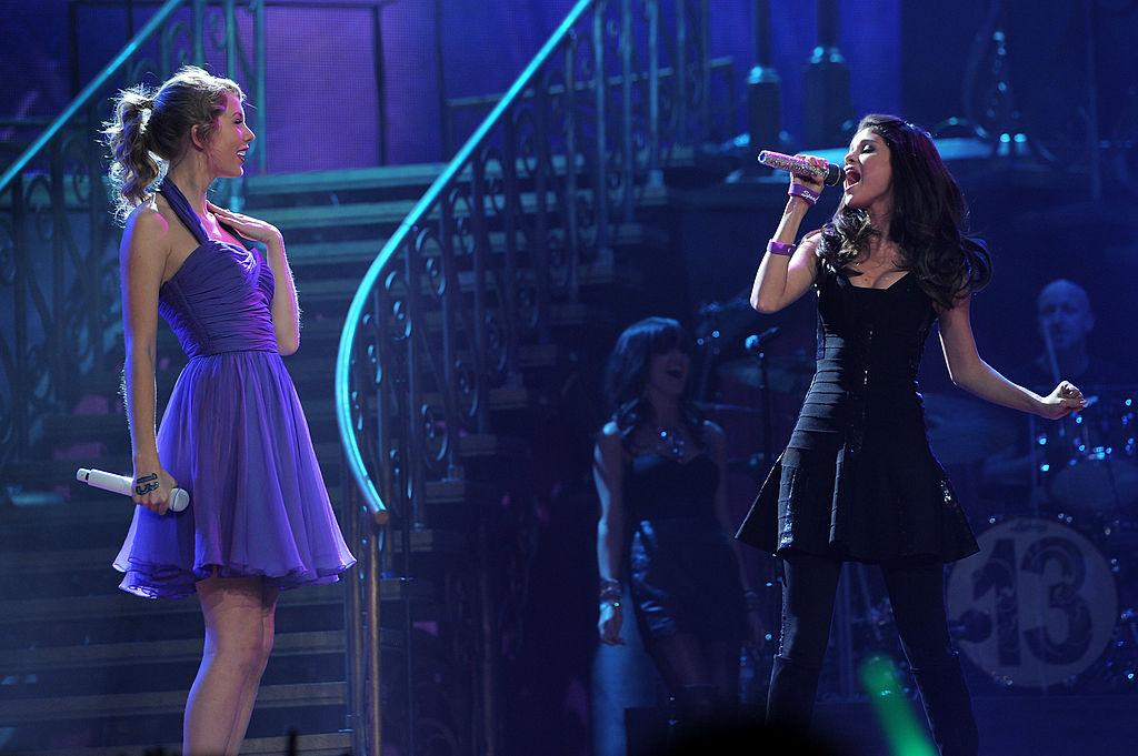 Taylor Swift wearing a short purple dress on her "Speak Now" world tour in New York