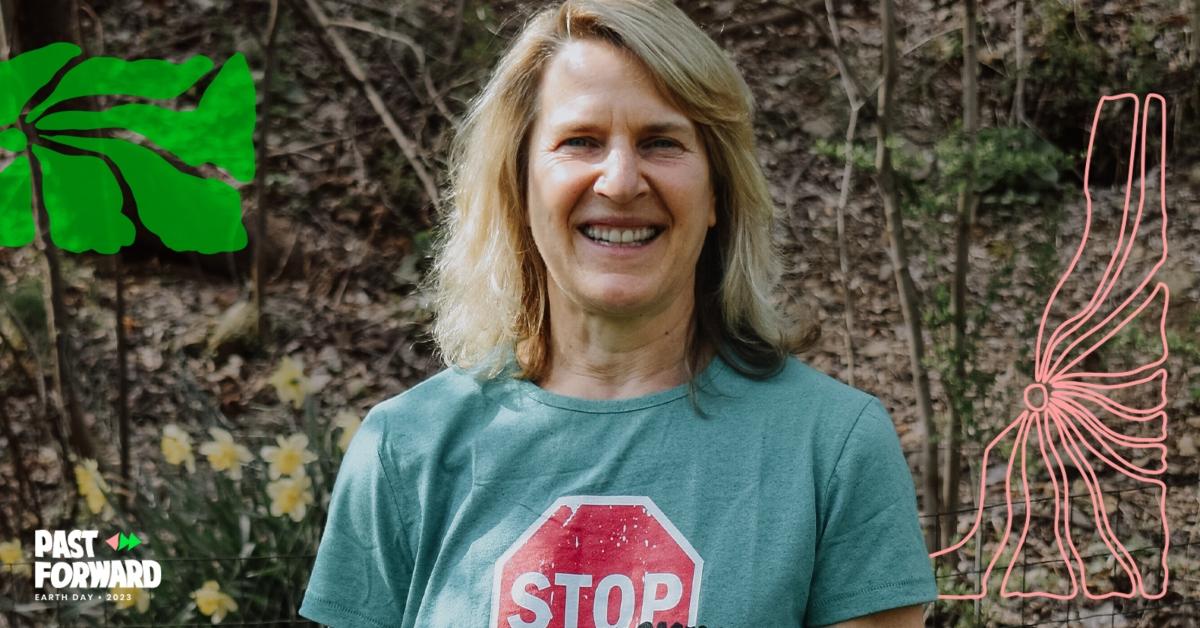 Delaware Riverkeeper Maya K. van Rossum smiles at the camera from the woods