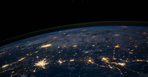 Cities light up on an ariel view of the Earth