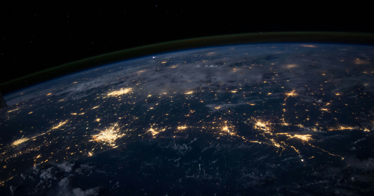 An overhead view of the Earth lit up in urban areas