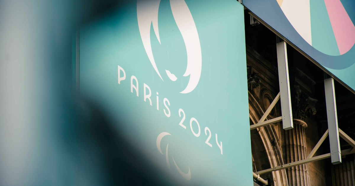 A Paris 2024 logo is visible between some decorations for the Paris Olympics 