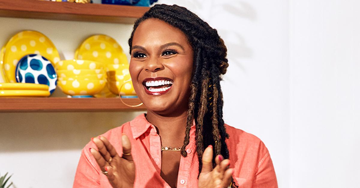 Tabitha Brown smiles in a kitchen