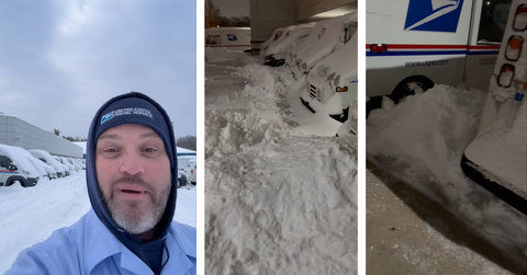 A mail carrier shows how much snow is near his mail trucks