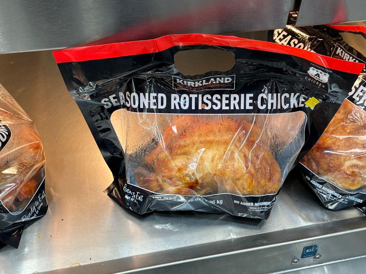 A bag of Costco's Seasoned Rotisserie Chicken is pictured on a shelf.