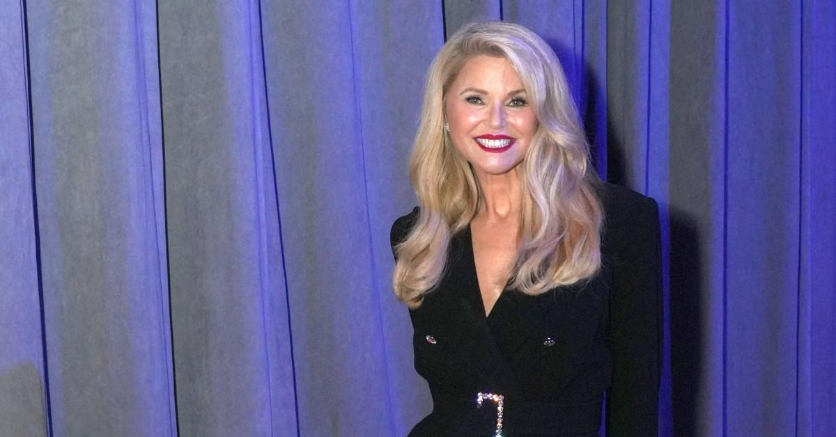 Christie Brinkley smiles as she poses for photos