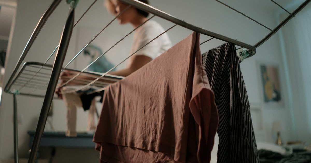 A person drying clothes inside his home. (Representative Cover Image Source: Pexels | Cottonbro studio)