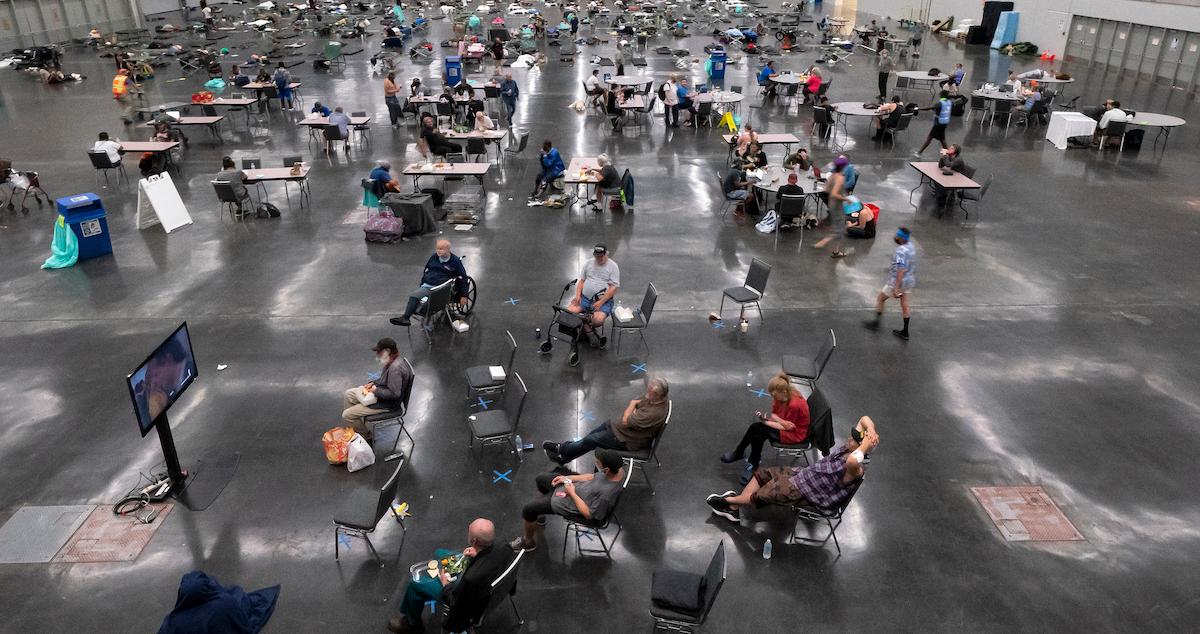 Portland residents fill a cooling center with a capacity of about 300 people at the Oregon Convention Center on June 27, 2021.