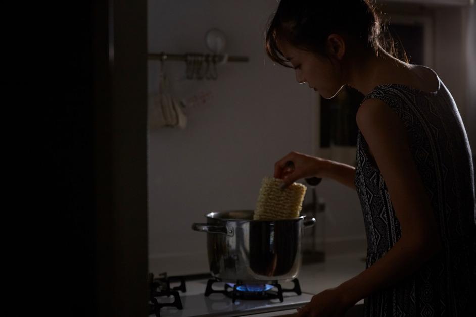 Woman cooking ramen