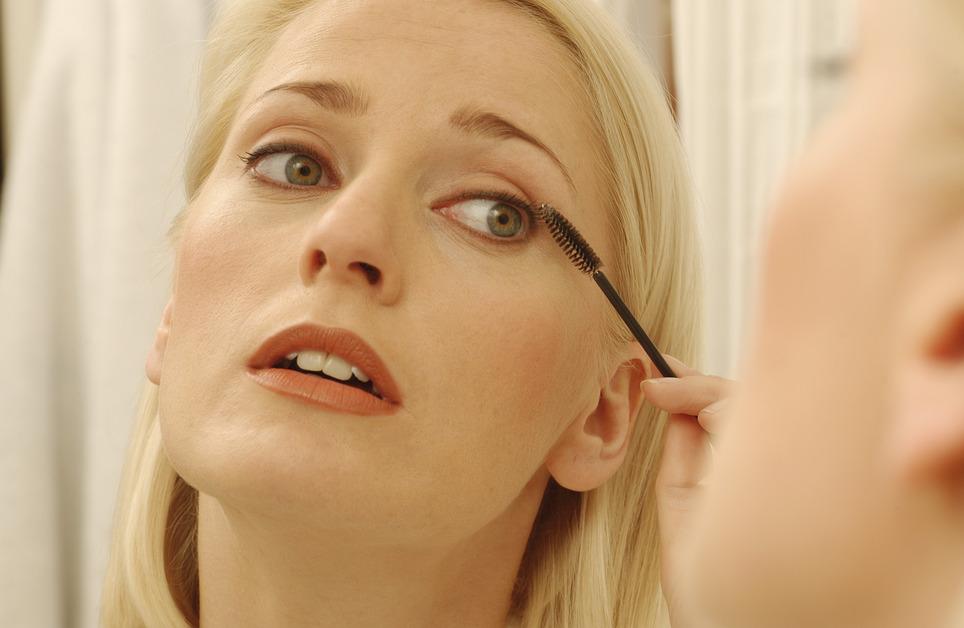 Women applying mascara