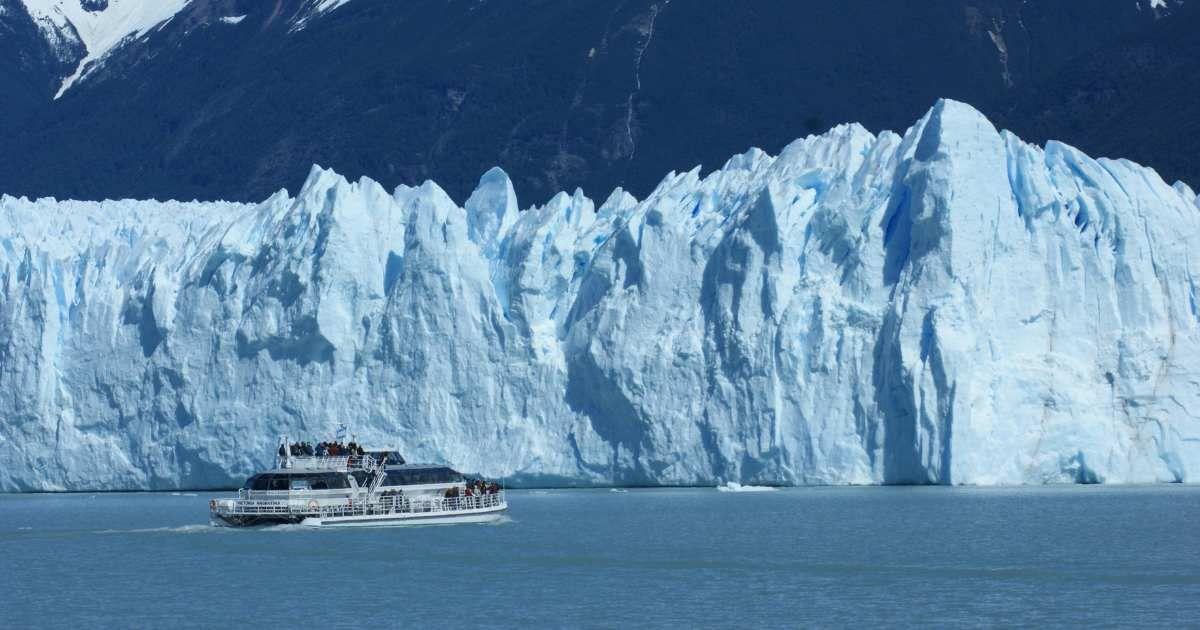 A ship carrying tourists sails closer to a massive iceberg in Antarctica. (Representative Cover Image Source: Pexels | Jan Zakelj)