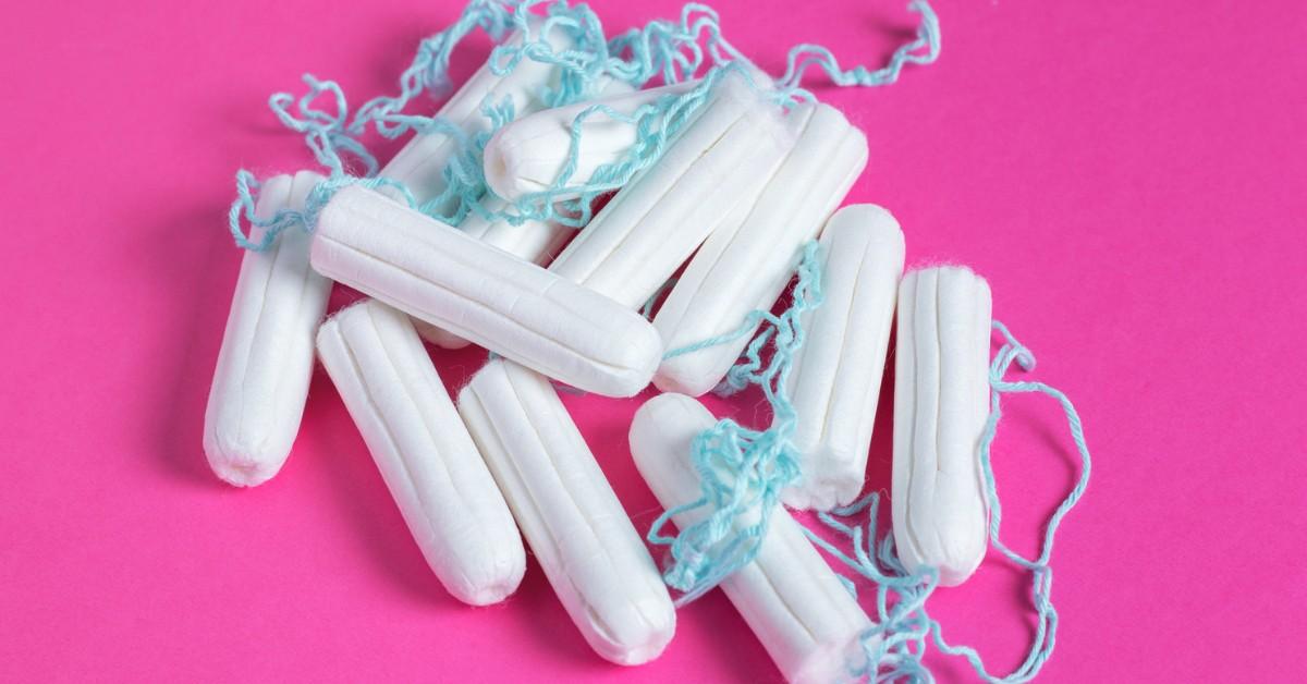 Closeup of a pyramid of tampons on a pink background