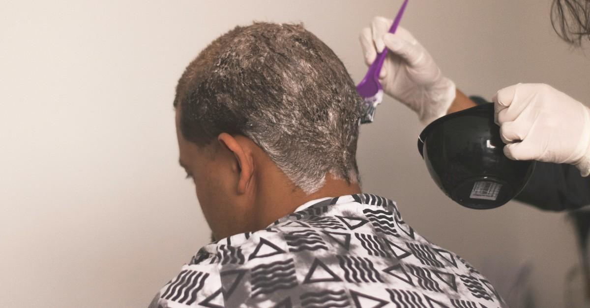 A Black person gets their hair done at the salon