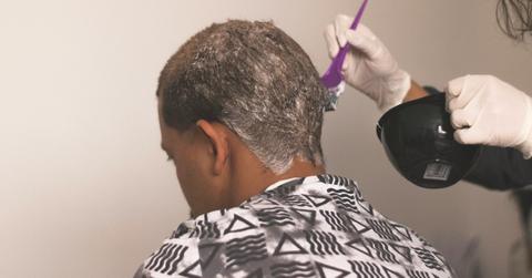 A Black person gets their hair done at the salon