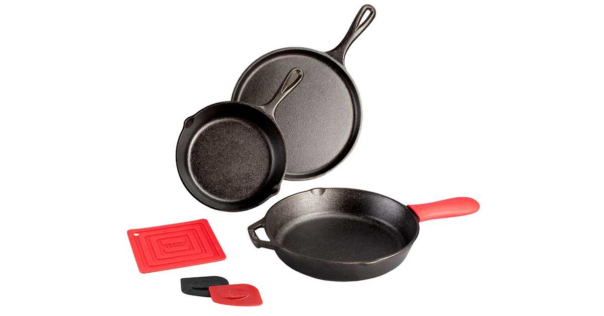 cast iron pans and skillet with red silicone holders