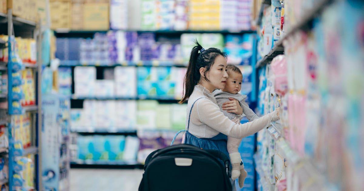 An Asian mother and daughter are selecting baby products at a retail store (Representative Cover Image Source: Getty Images | shih-wei)