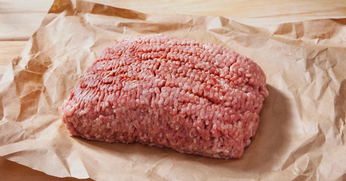 Ground beef packaged in a brown paper bag. 