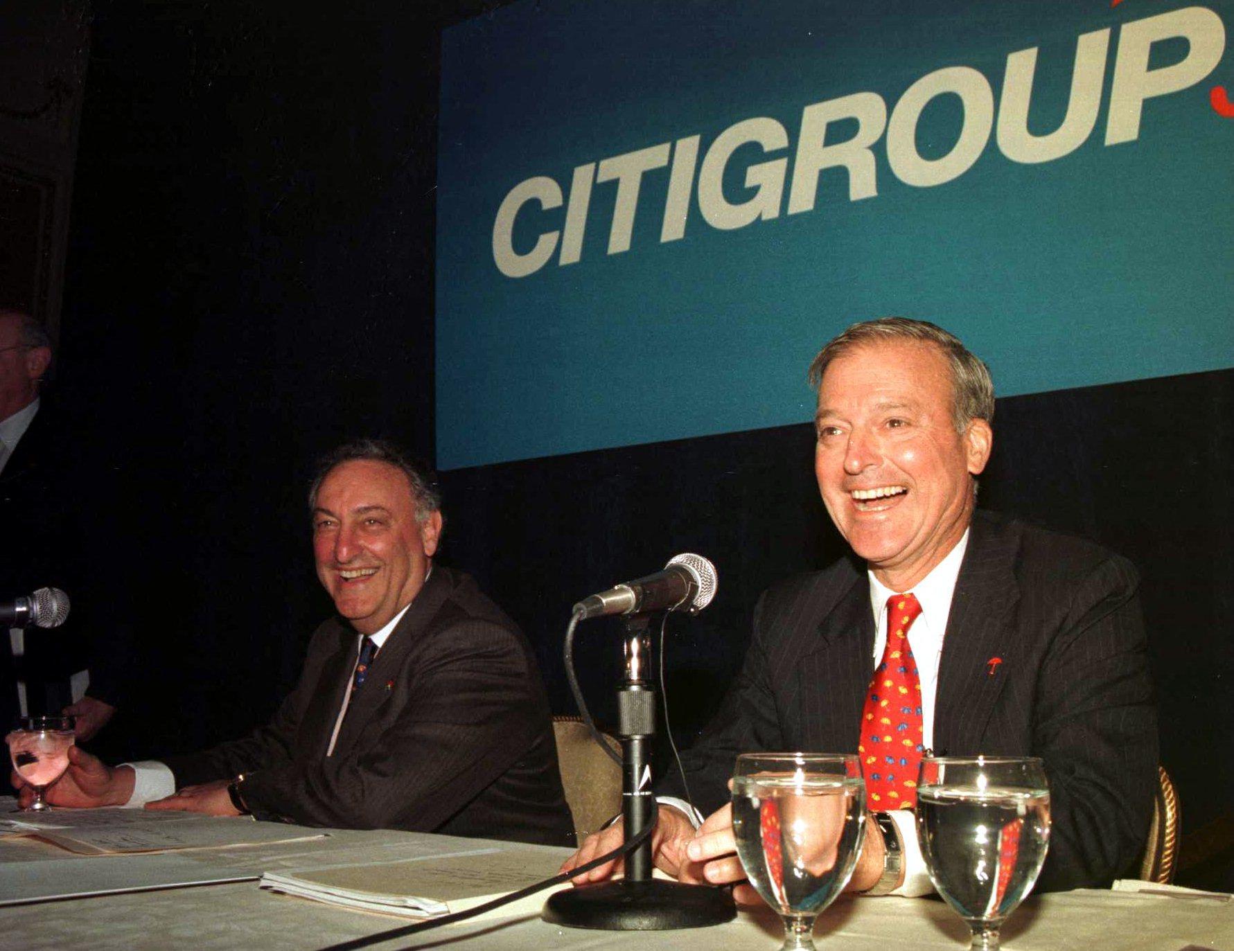 Sanford Weill attends a press conference in 1998 to announce a merger.
