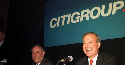 Sanford Weill attends a press conference in 1998 to announce a merger.