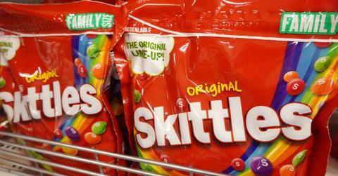 large bags of Skittles on store shelf