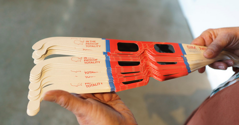 Person holding disposable glasses for protecting eyes during the eclipse