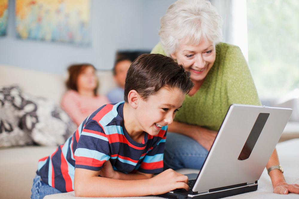 A Woman and Boy Using a Laptop