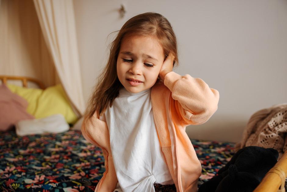 Little girl having an earache.