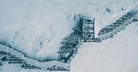 Zigzagging stairway covered in snow (Representative Cover Image Source: Pexels | Clement Proust)