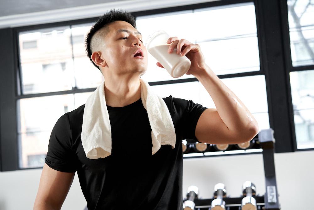 Man Drinking a Workout Supplement