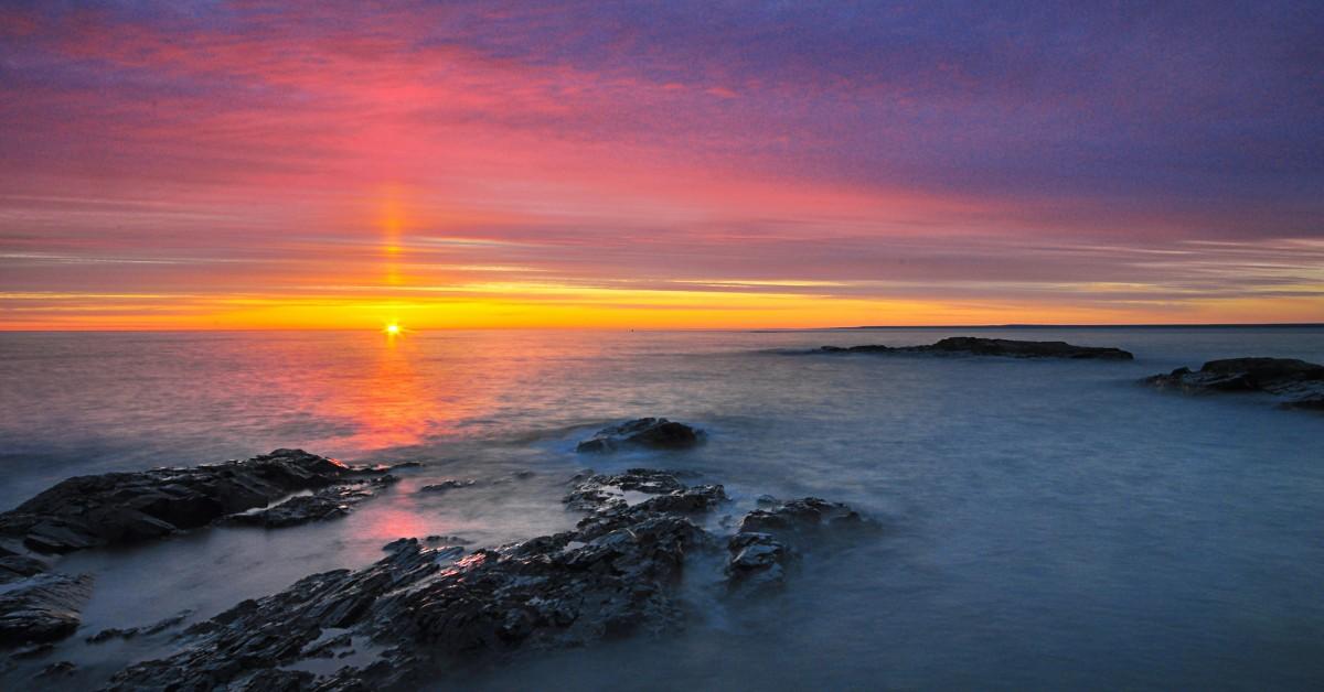 The sun rises over the waters of Lake Superior 