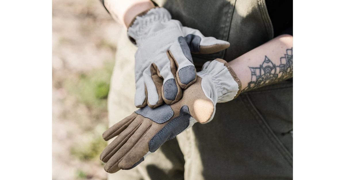 a person wearing vegan leather gardening gloves