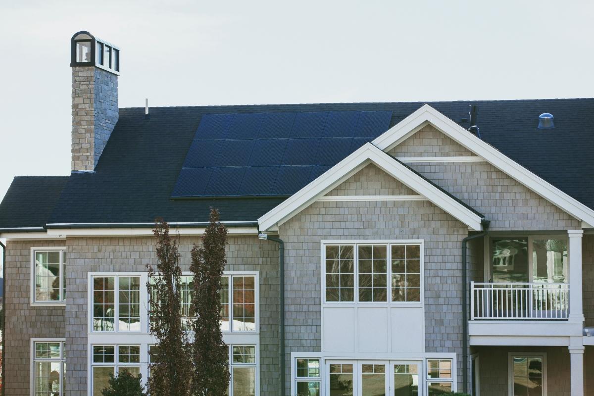 grey shingled home with solar panels