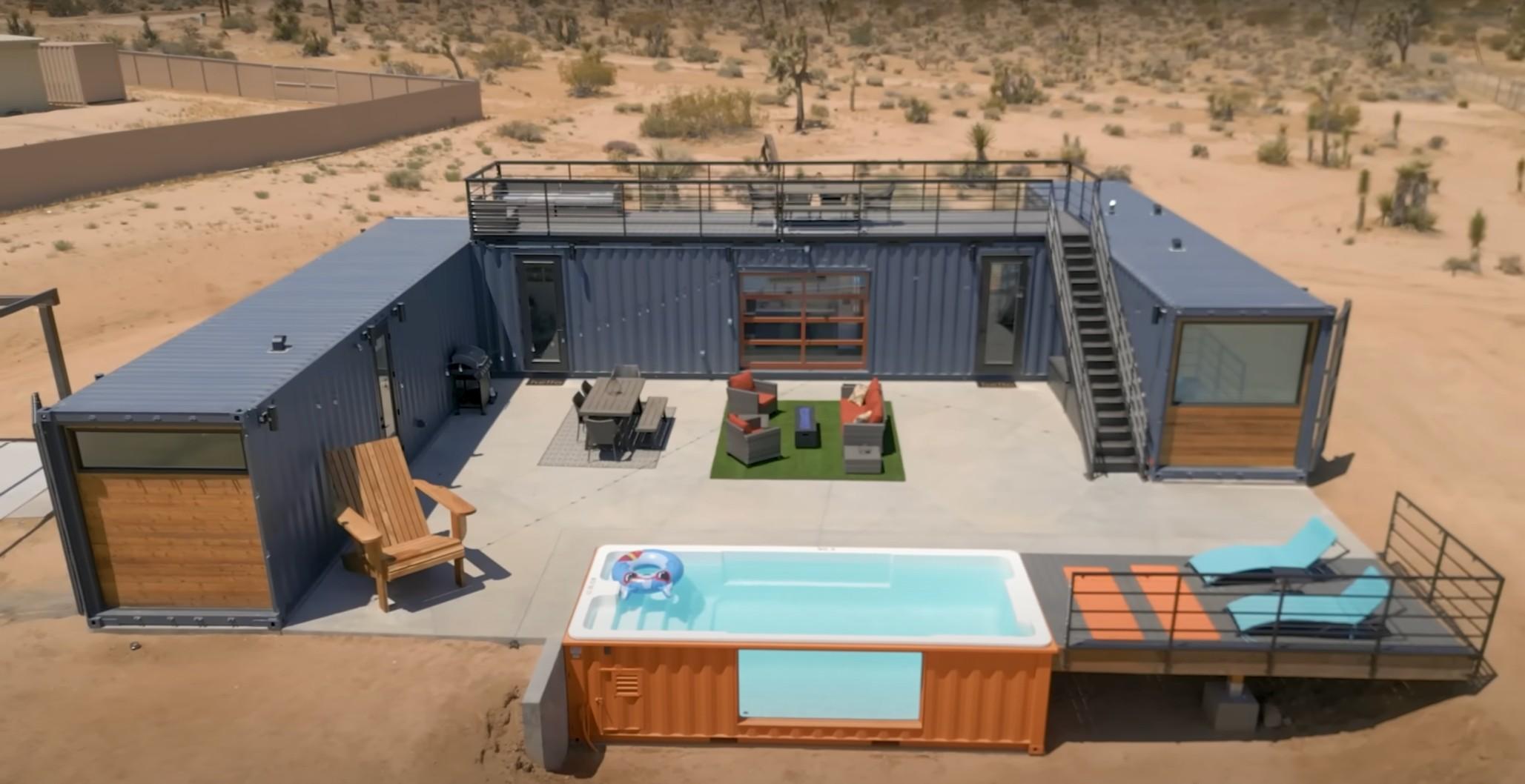 A house made of three shipping containers is depicted in a video.