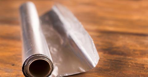 Aluminum foil on a wooden table.