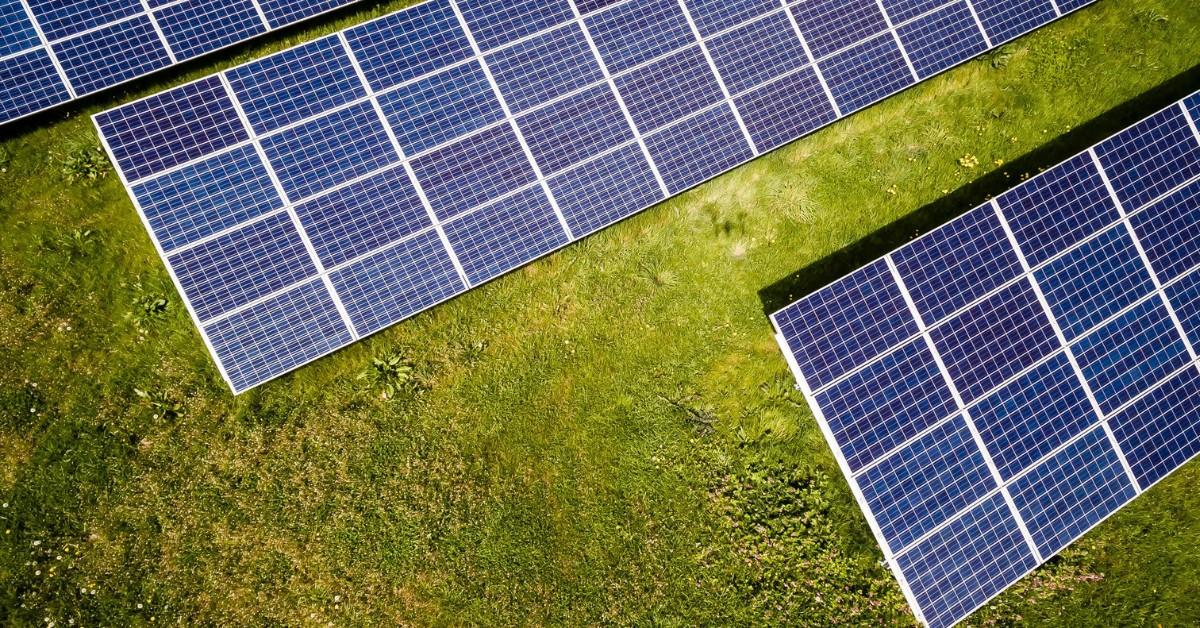 Solar panels sit on the ground