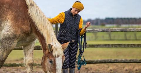 Ashley DiFelice and a horse at Twist of Fate Farm and Sanctuary.
