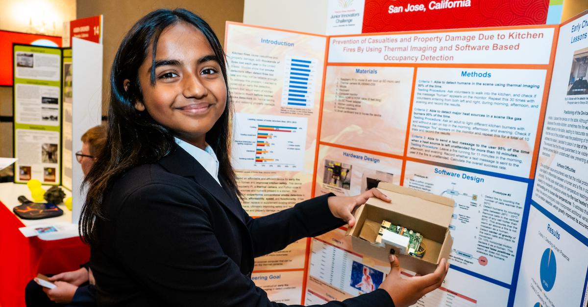 Shanya Gill with her fire detector and presentation board.