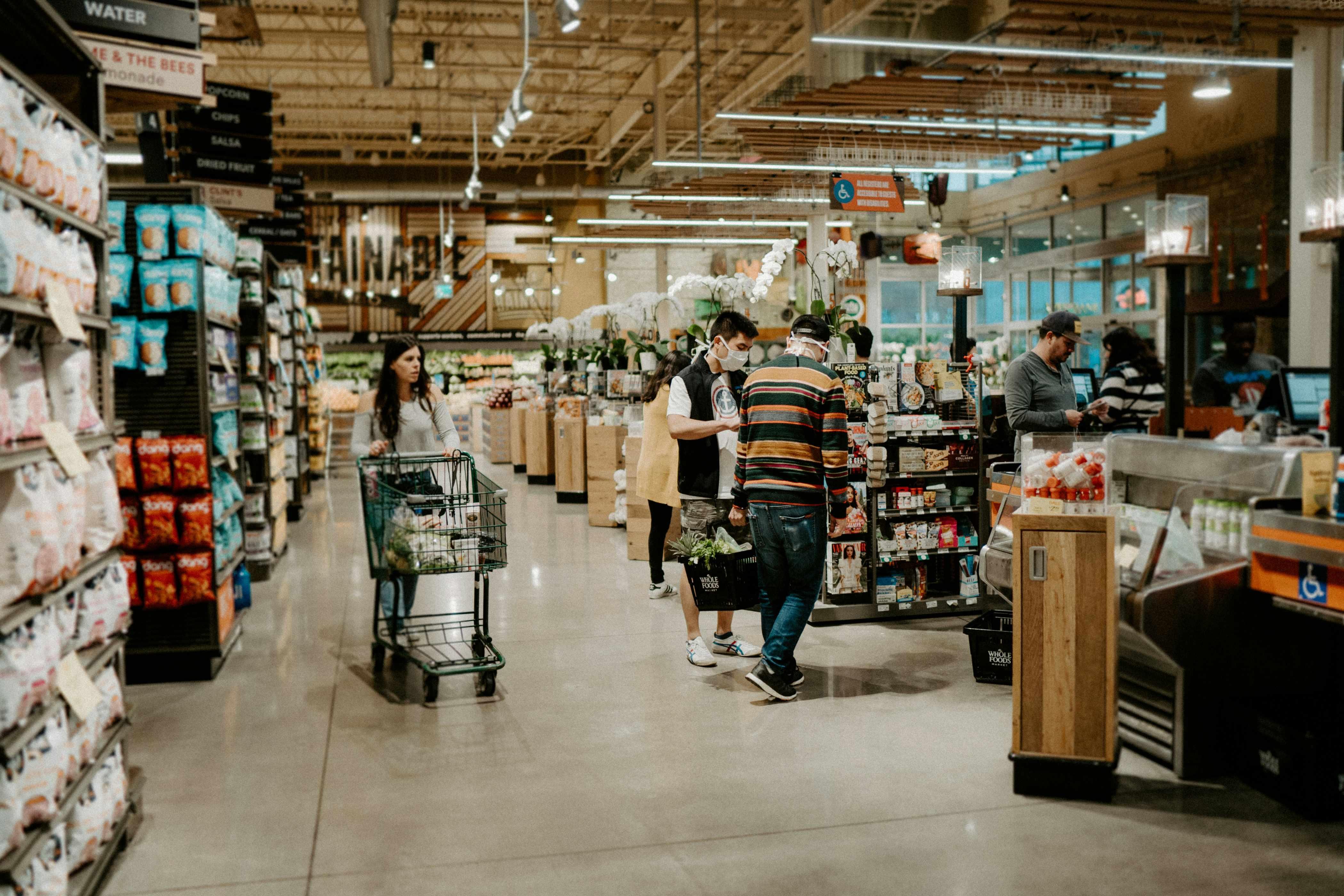 Whole Foods shoppers in Austin, Texas are pictured at the checkout line.