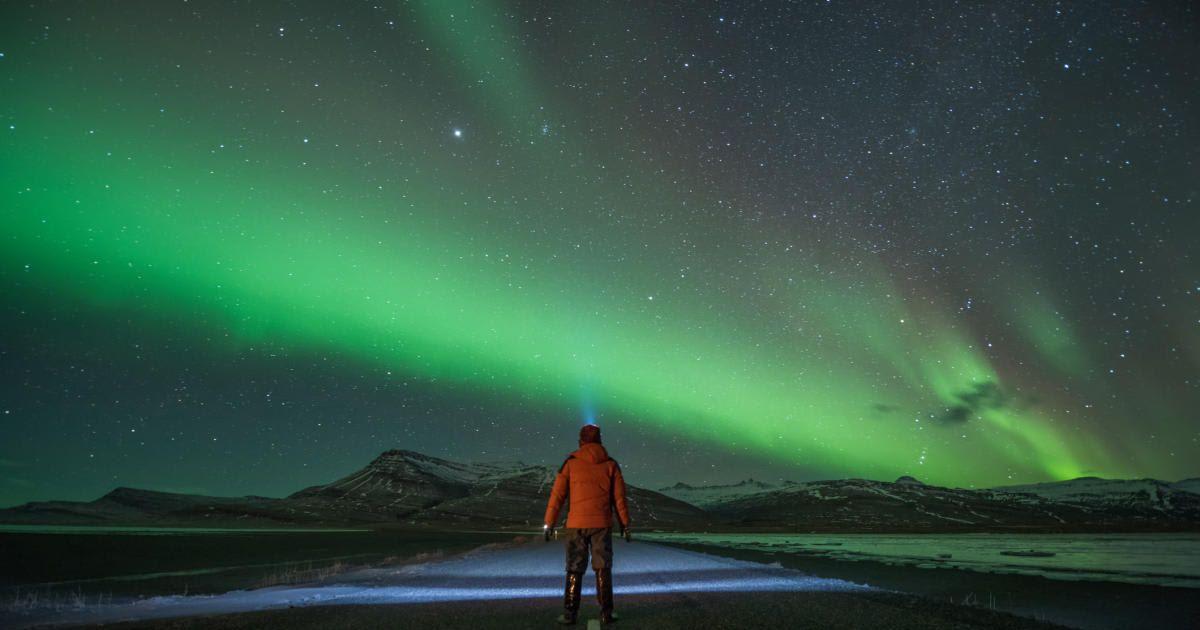 A man watching the Northern Lights. (Representative Cover Image Source: Getty Images | Sarawut)