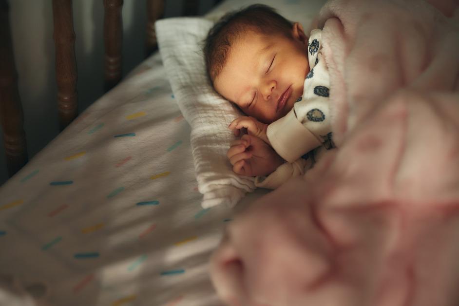 Stock photo of sleeping newborn baby girl. 