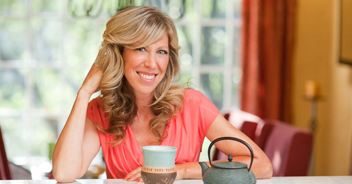 Colleen Patrick-Goudreau smiling at table